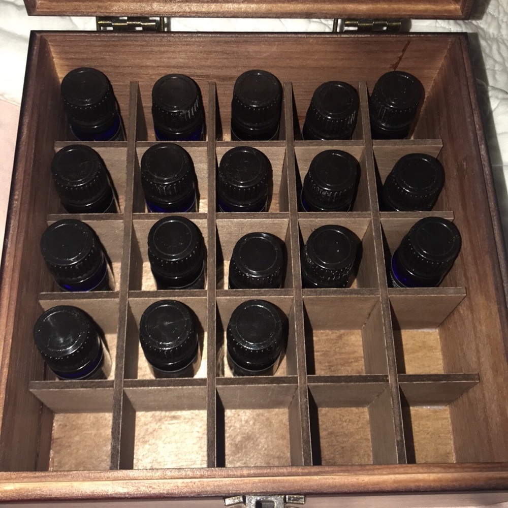 Radha Essential Oils with container to hold them!